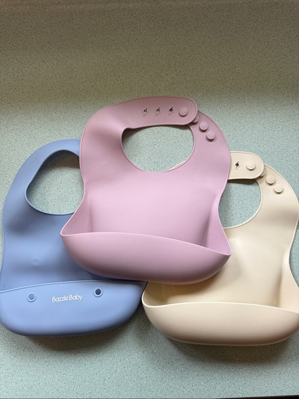 Mushie Silicone Baby Bib - Pink and Cream and Bazzle Baby travel bib in blue